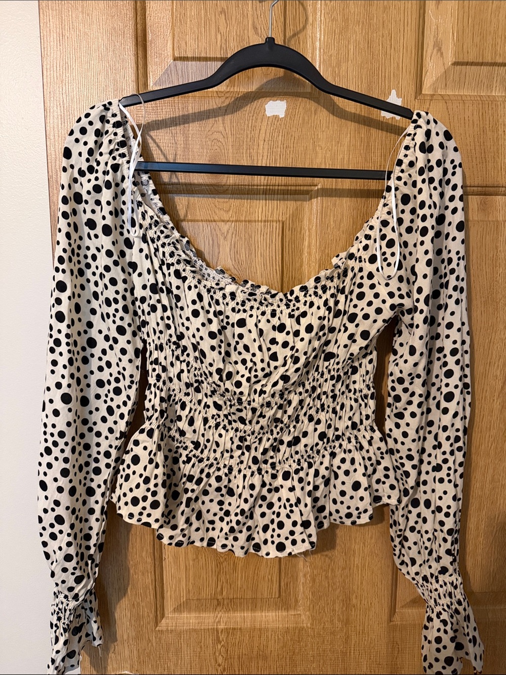 Cream Polka Dot Smocked Peplum Blouse